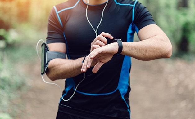running sprinter checking watch