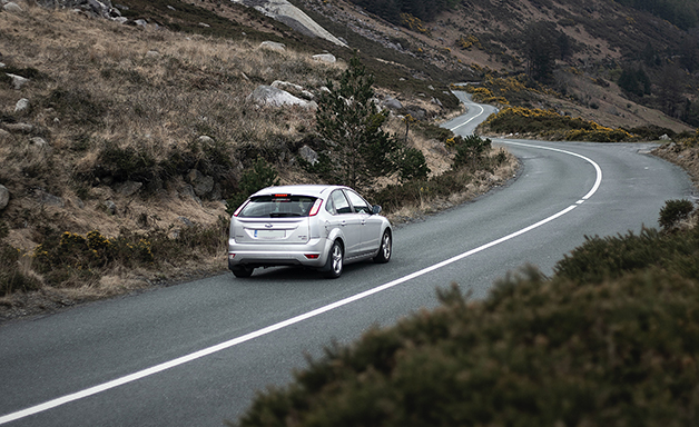 white car on the country road