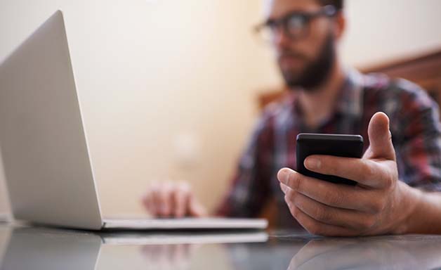 working on laptop and mobile