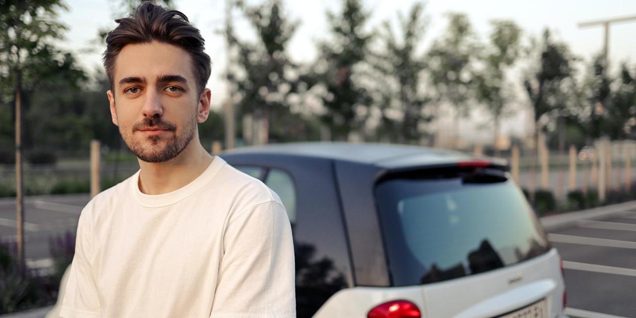 Man young driver next to his car