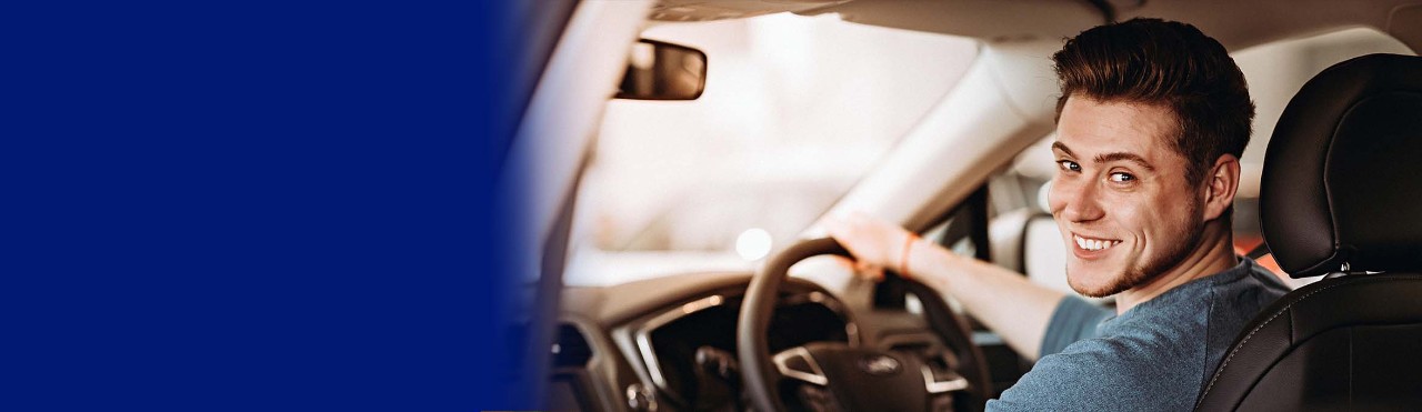young man driving the car