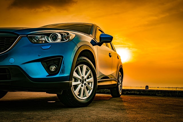 Car under the sunset