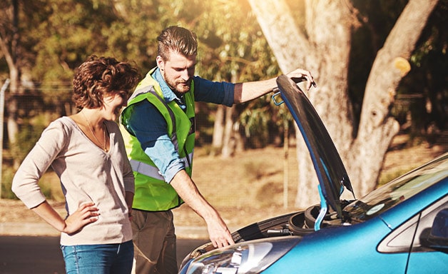 car breakdown assistance mechanic woman