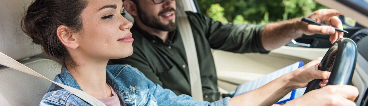  Driving instructor with female driver