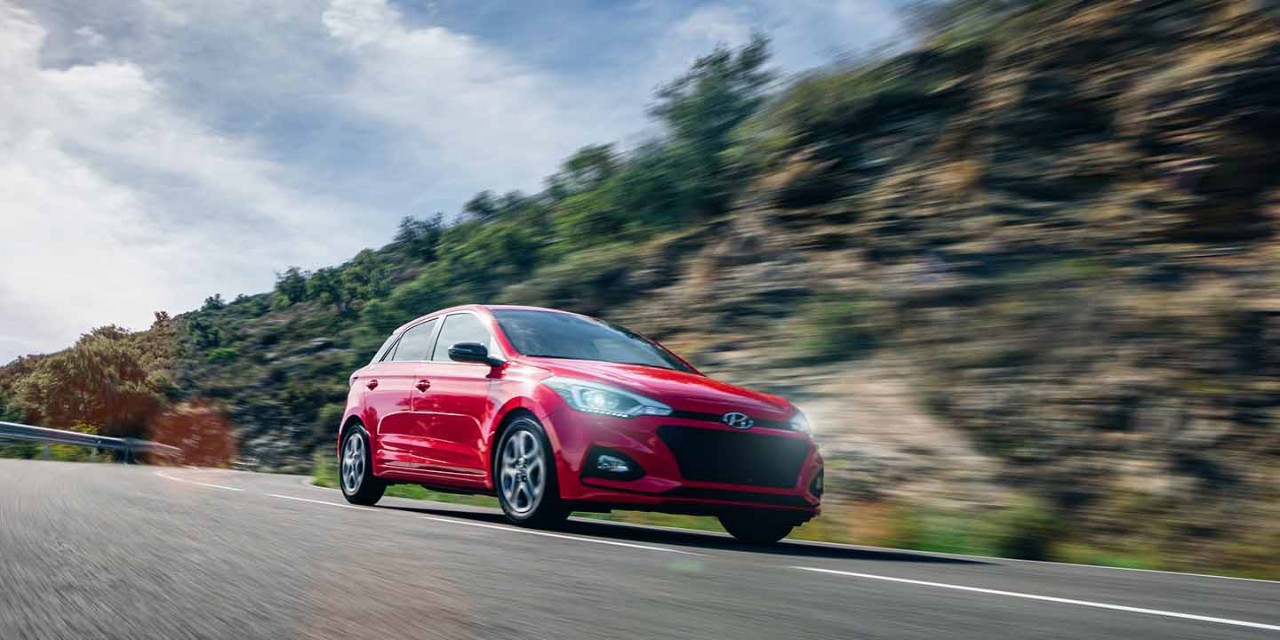  Generic red car driving fast on the open road