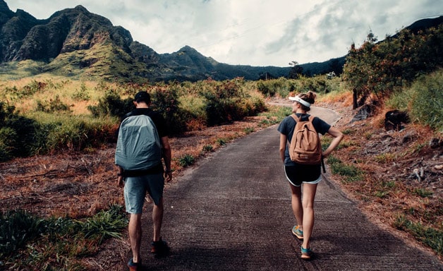 Travel backpacker couple on the road