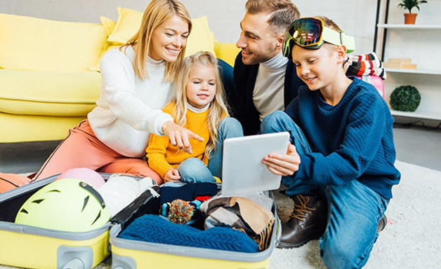 family prepare travel suitcase