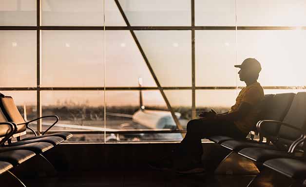 man sitting at the airport