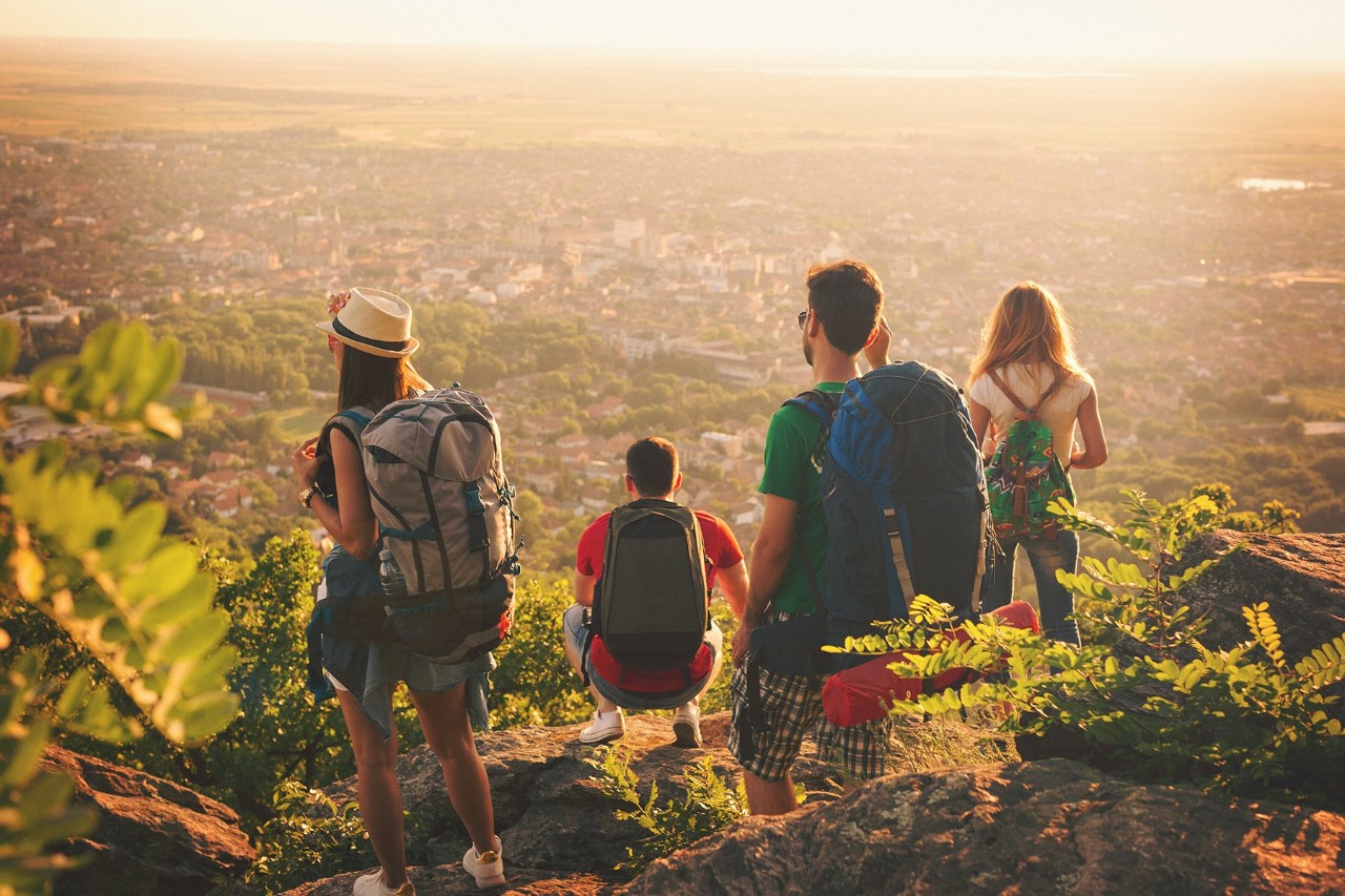 backpacker friends sunset