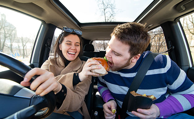 Do not feed someone else food while you are driving a car