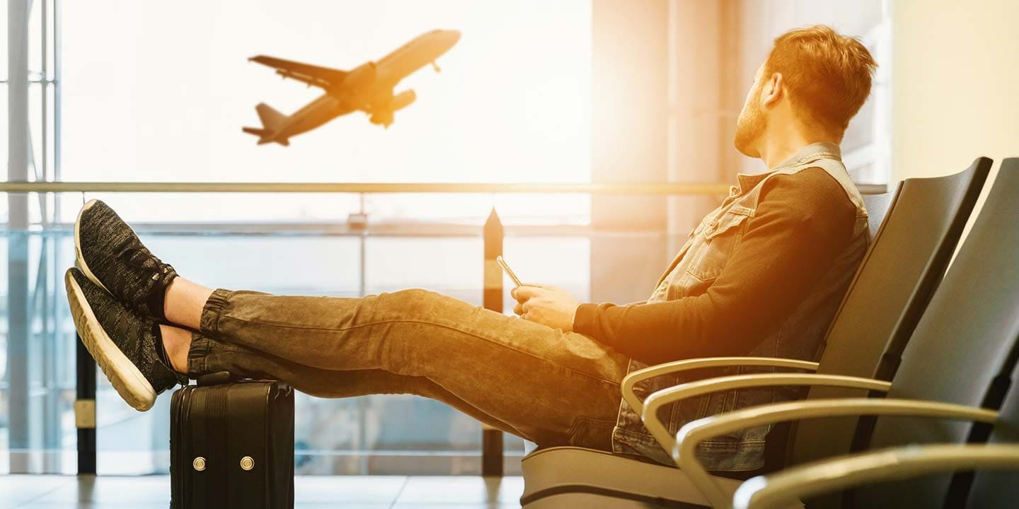 Man Relaxed Sitting On Airport