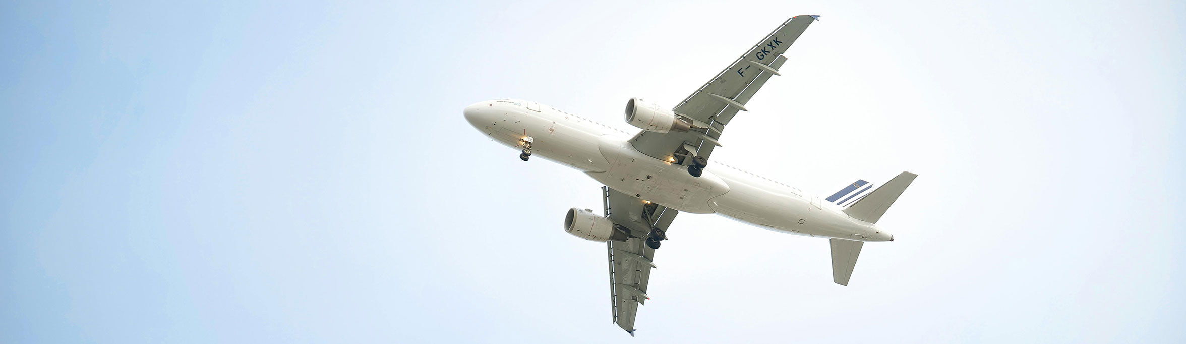  White airplane on the blue sky